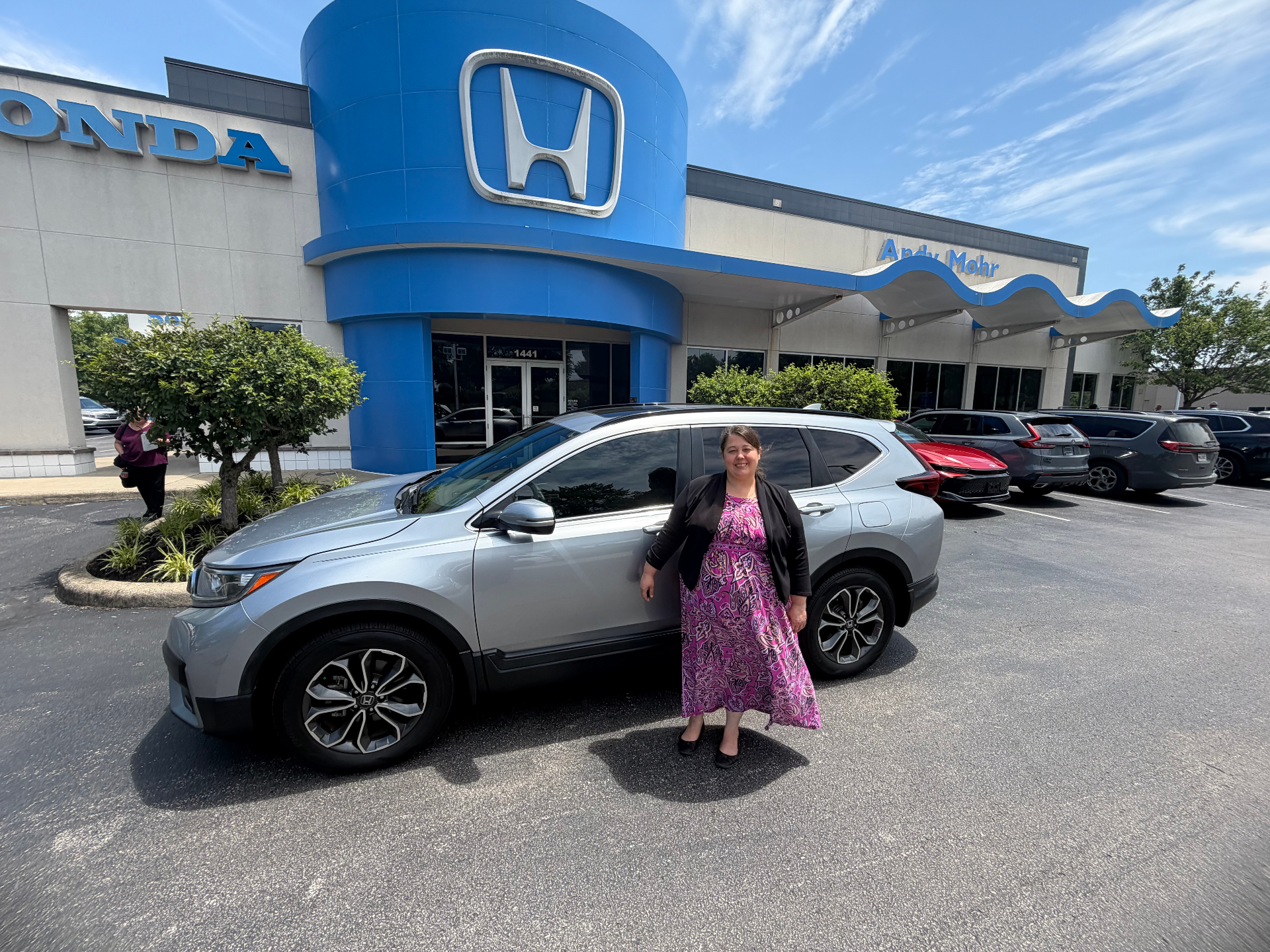 Happy customer with her new vehicle